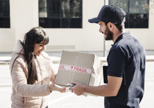 delivery-man-delivering-parcel-female-customer